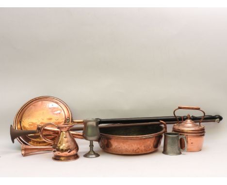 A collection of mixed copper and brass ware, a miners lamp, warming pan etc