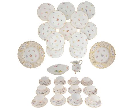 A 20th century Meissen porcelain twelve setting tea service decorated with scattered sprays, shaped gilt edged rims, comprisi