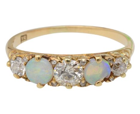 An opal and diamond set ringthree round brilliant-cut diamonds set between two circular cabochon opals, of slightly graduatin