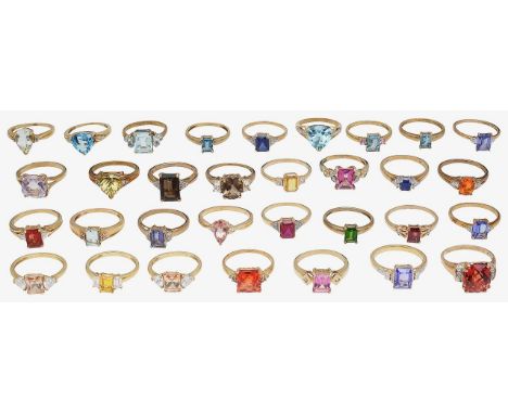 A selection of 9ct gold, colourful gem-set rings mostly rectangular cut gems, of varying design and colour, stamped with hall