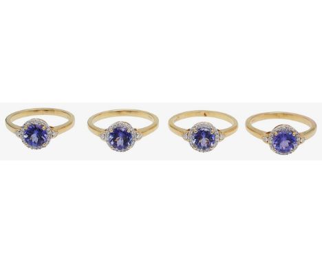 Four 18ct gold and tanzanite set cluster ringscentral circular mix-cut tanzanite set within a diamond border, to a plain 18ct
