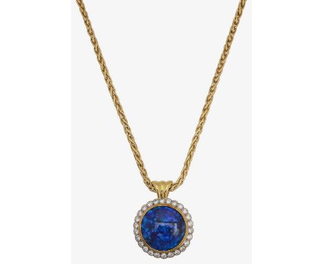 An 18ct gold, black opal and diamond set pendantcentral circular black opal cabochon, collet set within a diamond set border,