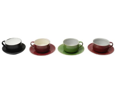 Rupert Spira (British b.1960) Four studio pottery teacups and saucersone green glazed, one matte black glazed and two copper 