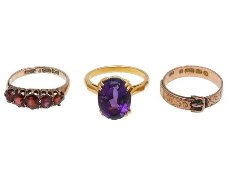 Three ringsamethyst single stone ring, central oval mix-cut amethyst, claw-set to a basket mount, tapering to a plain shank, 