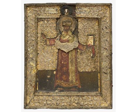 A 19th century Russian Icon of St Nicholas the Wonderworkertempera on gesso on wood paneldepicted full length holding a gospe