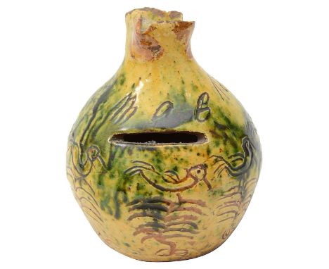 A 19th century Donyatt slipware earthenware pottery money box of squat form with pinched trefoil neck, sgrafitto decorated wi