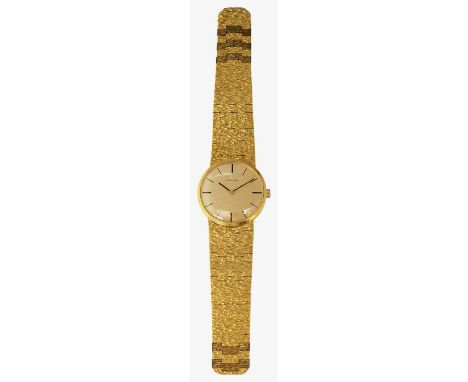 A gentleman's manual wind gold plated Longines wristwatch the gold coloured dial with baton numerals and textured gold plated