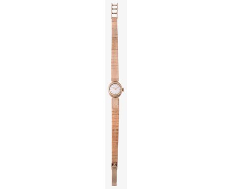A Certina manual wind 9ct gold bracelet watchthe round dial with silvered dial and baton numbers, 9ct gold articulated bracel
