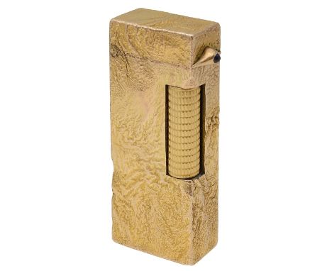 A 9ct gold mounted Dunhill 'Rollagas' lighter.With textured finish, in its original fitted case.Hallmarked Alfred Dunhill, Lo