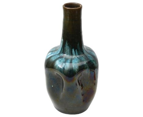 A Linthorpe Art Pottery vase designed by Dr Christopher Dresserlate 19th century, shape 24, of bottle form with dimpled sides