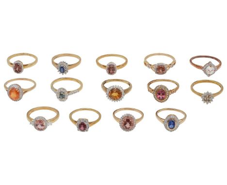 A collection of 9ct gold and gem set cluster ringsof varying design, set with reddish-brown, orange, blue and colourless gems