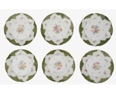 A set of six Russian Kuznetsov porcelain plates early 20th centuryhand painted with a central bouquet of Deutsche Blumen and 