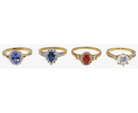 Four rings18ct gold and cubic zirconia set ring, central round brilliant cut cubic zirconia claw set between two cubic zircon