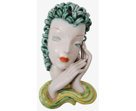 Goldscheider. Art Deco wall maskmodel no. 7495, Vienna, circa 1938terracotta, decorated in yellow, green and orange glazes on