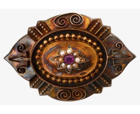 A Victorian ruby and half pearl etruscan broochfeaturing a raised oval boss, star set, split pearl and ruby cluster, an ellip