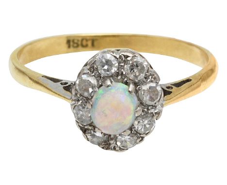 An opal and diamond cluster ringcentral oval cabochon opal, claw set above a mix-cut diamond set surround, tapering to a plai