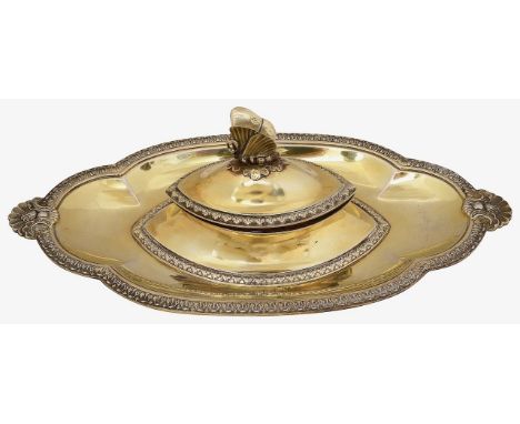 A late Victorian silver-gilt inkwellLondon, 1887, R &amp; S Garrard &amp; Co the central navette shaped well with hinged cove