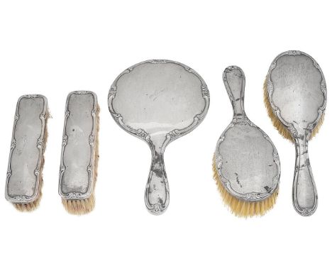 A George V silver five piece dressing table setBirmingham, 1924, Henry Matthews of plain design with raised scroll border, en