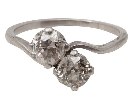 A diamond two stone cross over ringeach old brilliant-cut diamond obliquely-set to the tapering shankring size M, 3.8gConditi