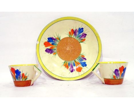 Clarice Cliff plate in the crocus pattern, 23cm diameter (chipped) and two crocus pattern tea cups (3) 