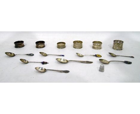 Six silver and enamel souvenir spoons, two other silver spoons, silver thimble and six assorted silver napkin rings 