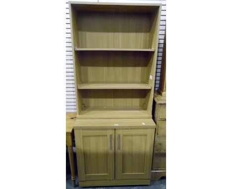 Modern pale wood-effect bookshelf with two open shelves, panelled cupboard below with further shelf, width 381cm 