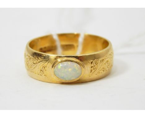 22ct gold engraved ring set with small opal, 5.7g