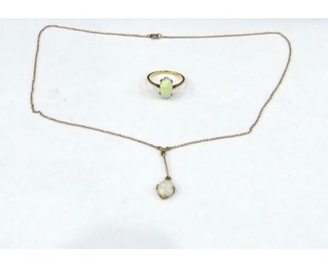 18ct gold and opal oval cabochon set ring and a 9ct gold and opal oval set cabochon set drop pendant, the ring 3g in total, r