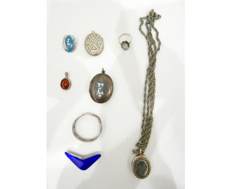 Silver locket on chain, sundry silver rings, silver and enamel boomerang shaped brooch, marked TYA, enamelled locket (damaged