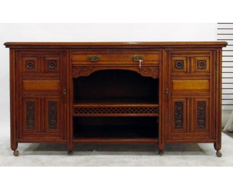 Large late 19th/early 20th century sideboard/buffet with single frieze drawer, two carved and panelled drawers, central reces