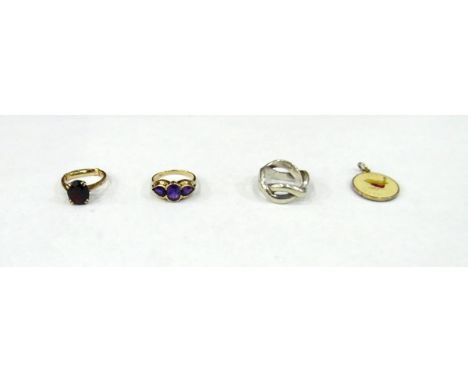 9ct gold and amethyst set ring, a 9ct gold and garnet set ring, a silver-coloured ring and an enamel pendant (4) 