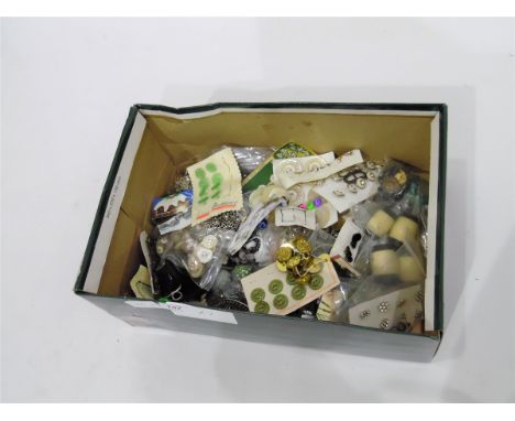 Large quantity of vintage and later buttons and a box of, what is believed to be, large remnants of parachute silk and a full