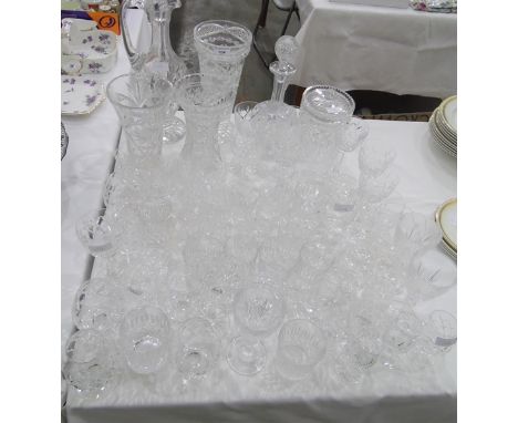 Large quantity of assorted cut glass including a claret jug/decanter, vases, wines, tumblers, brandy balloons, a biscuit barr