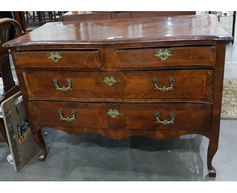 18th century French figured walnut commode with two short and two long graduated drawers, serpentine fronted, the top with br