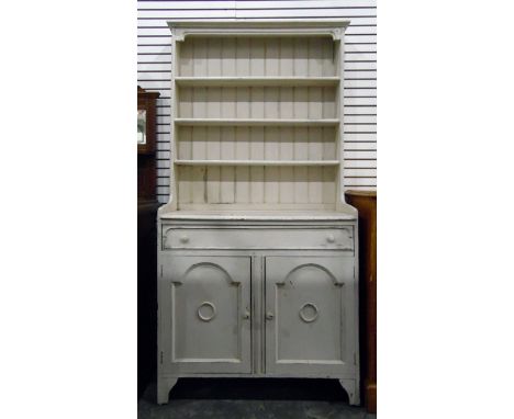 White painted kitchen dresser, the rack with three open shelves, with long frieze drawer and a pair of arched panelled doors 