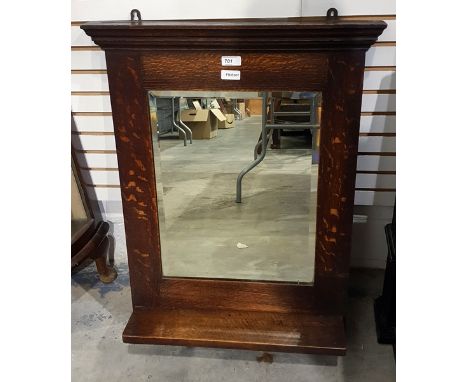 Early 20th century oak-framed wall mirror with rectangular bevelled plate and shelf, height 73cm 