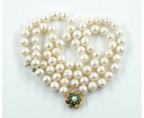 A TWO ROW NECKLACE OF BAROQUE CULTURED PEARLSOn a gold, turquoise and cultured pearl clasp, designed as a flowerhead, detaile