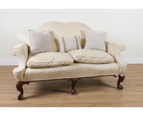 A GEORGE I STYLE DOUBLE HUMPBACK SOFAOn mahogany ball and claw carved supports, 175cm wide; 103cm high
