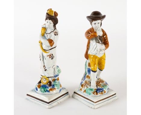 TWO PRATT WARE FIGURES FROM THE SEASONS (2)Circa 1800
Summer represented by a girl carrying a cornucopia, Autumn as a boy hol