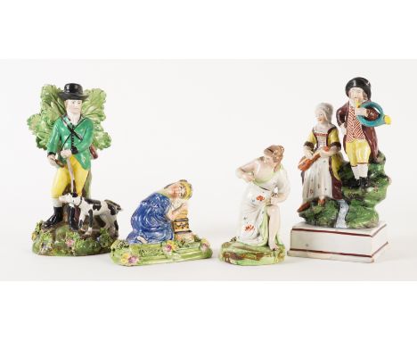 FOUR STAFFORDSHIRE PEARLWARE FIGURES (4)Early 19th century
Comprising; a figure of a hunter with dog, 18.5cm high; a figure a