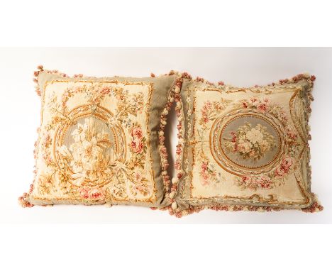 A PAIR OF AUBUSSON TAPESTRY CUSHIONS (2)19th Century 
Woven with a bouquet of flowers, with later silk backs, 57 57cmProvenan