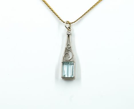 A BLUE TOPAZ AND DIAMOND PENDANT AND A GOLD NECKCHAIN (2)The pendant mounted with a rectangular step cut blue topaz and with 