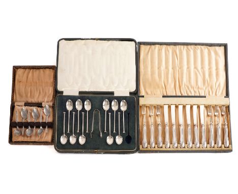 ELEVEN SILVER TEASPOONS AND A PAIR OF SILVER SUGAR TONGS AND TWO FURTHER CASED SETS OF FLATWARE (3)The eleven teaspoons and t