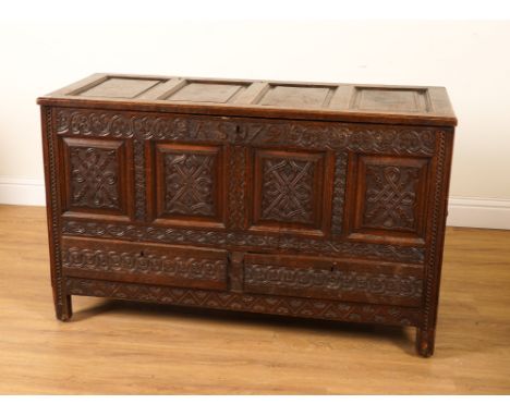 AN 18TH CENTURY AND LATER OAK MULE CHESTWith carved panel front 138cm wide; 57cm deep; 87cm high