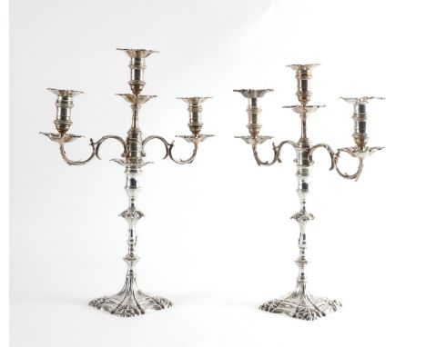 A PAIR OF SILVER TABLE CANDLESTICKS WITH ASSOCIATED SILVER THREE LIGHT CANDELABRA BRANCHESEach candlestick with a knopped ste