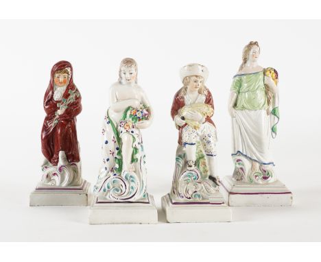 A GROUP OF FOUR PEARLWARE FIGURES (4)Circa 1790-1800
Comprising; a Wilson figure of Ceres; a Neale and Co. figure of Winter a