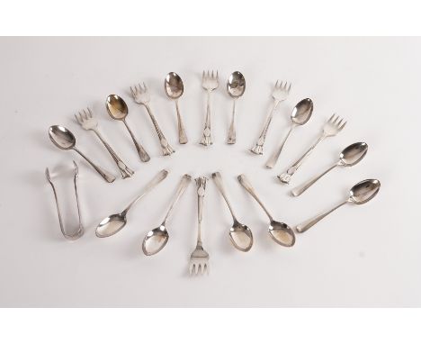 A GROUP OF SILVER FLATWARE (18)Comprising; eleven rat tail pattern coffee spoons and a pair of sugar tongs, Sheffield 1917 an