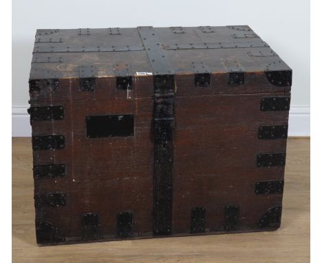 A 19TH CENTURY OAK METAL BOUND RECTANGULAR TRAVELLING TRUNK85cm wide; 58cm deep; 61cm high