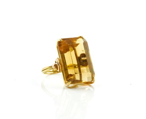 A GOLD AND CITRINE SINGLE STONE RINGClaw set with a cut cornered rectangular step cut citrine, unmarked, ring size M, gross w