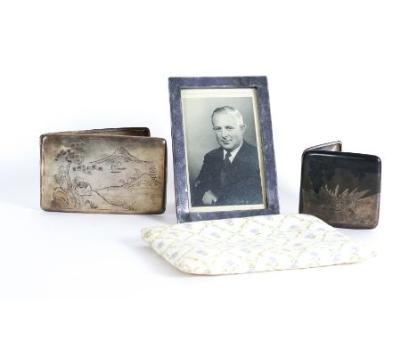 AN ASIAN SILVER MOUNTED RECTANGULAR PHOTOGRAPH FRAME AND TWO ASIAN CIGARETTE CASES (3)The photograph frame with character mar